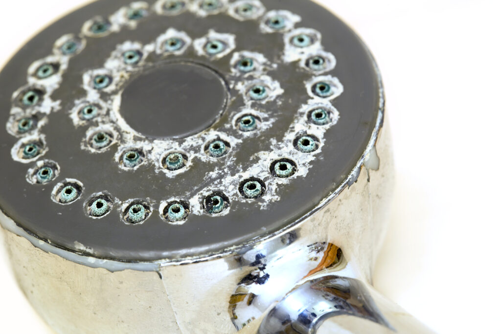 Shower head with lime causing low water pressure in shower